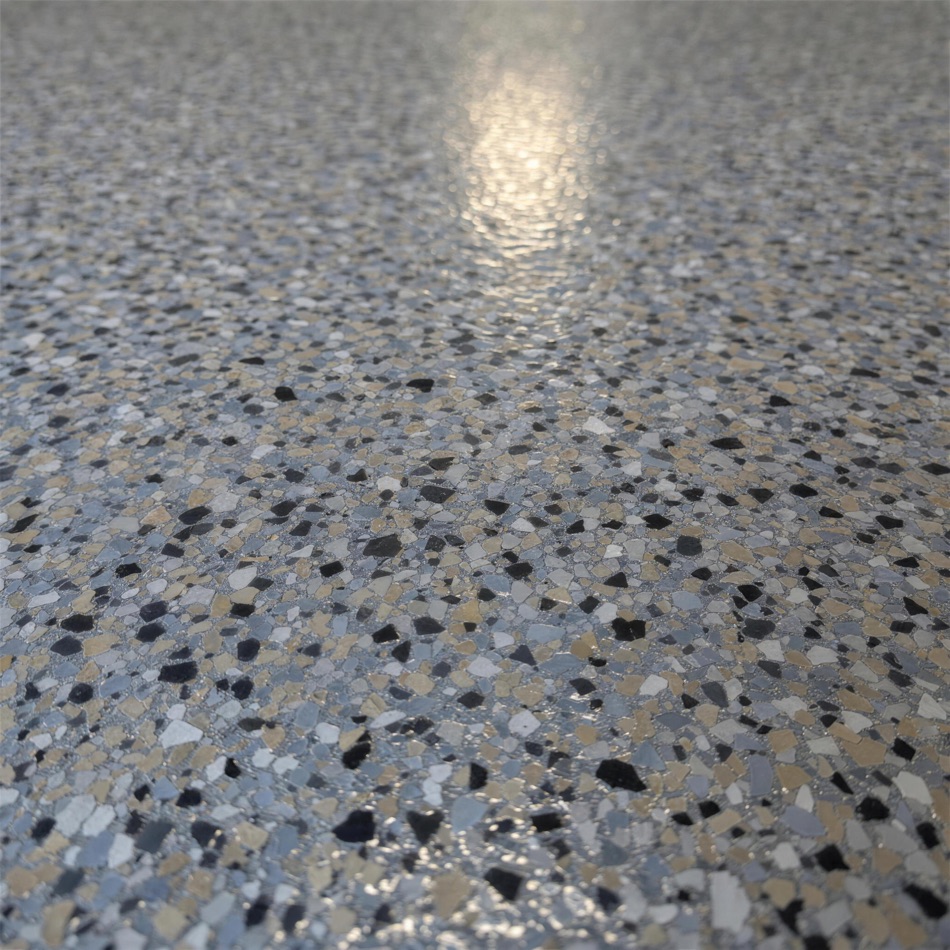 Close-up of the decorative flake blend in the cured top coat